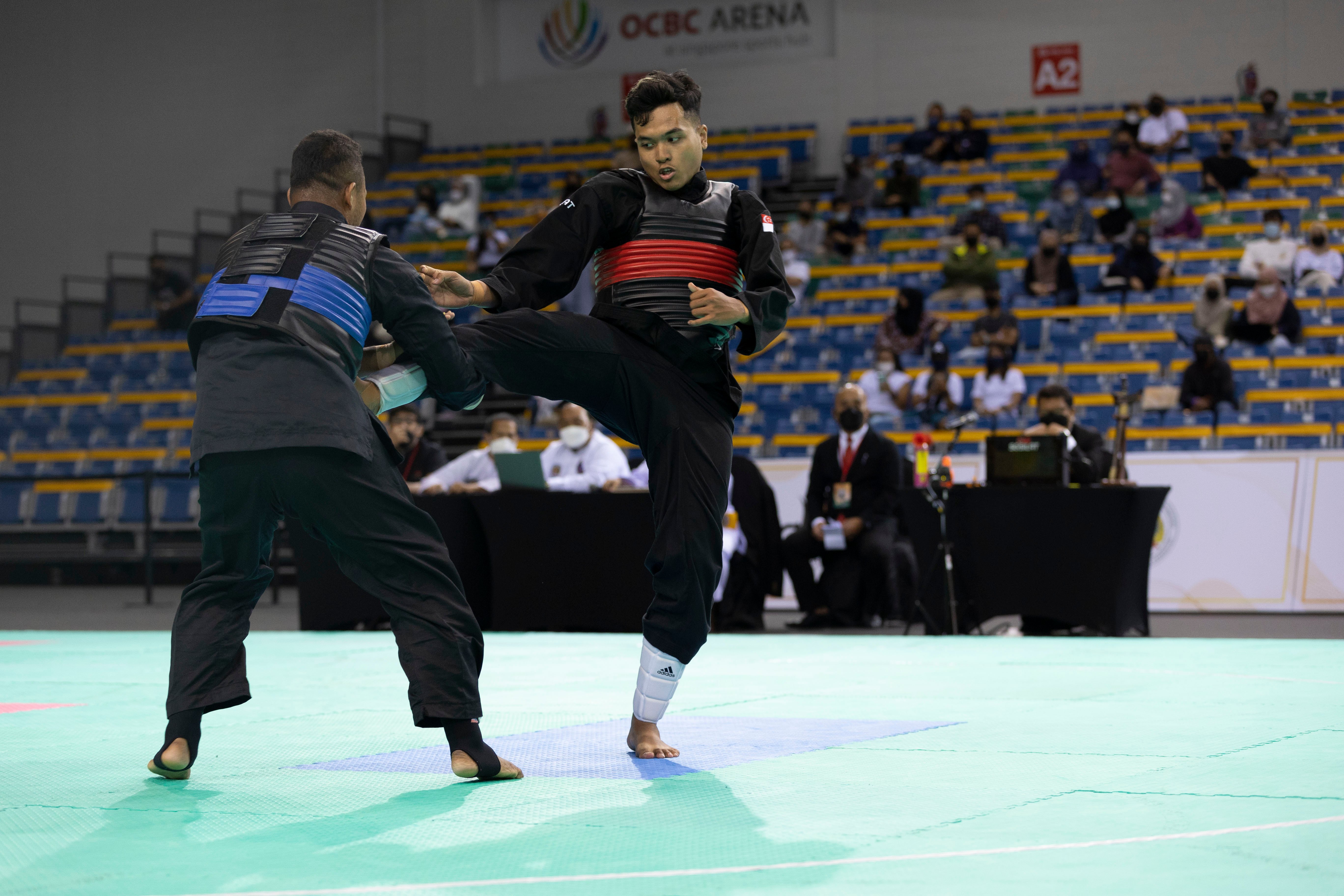 20220227_Muhammad Syahiran Bin Jeffry (Singapore, red belt) vs Hendra Wakhyu Hidayat (Indonesia) 001_Photo credit to Singapore Silat Federation