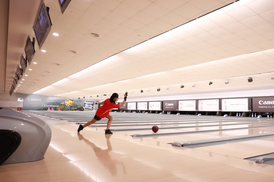 Professional youth athlete bowling at Singapore Bowling