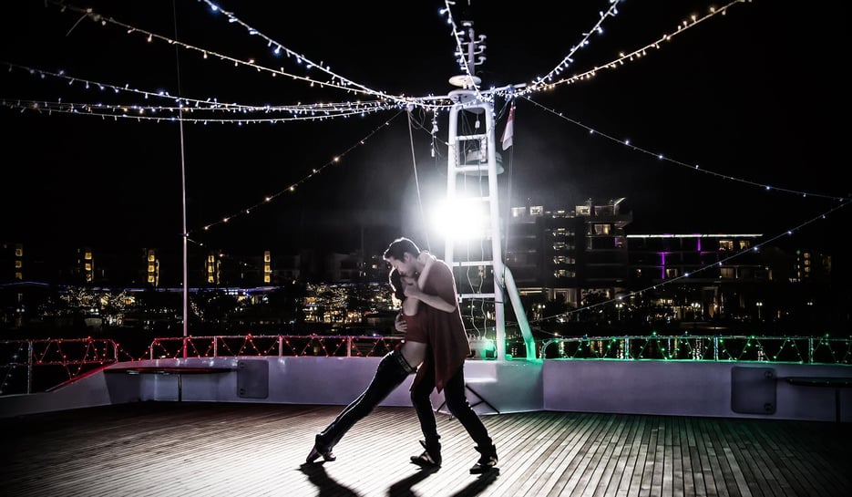 Couple dancing on ship deck